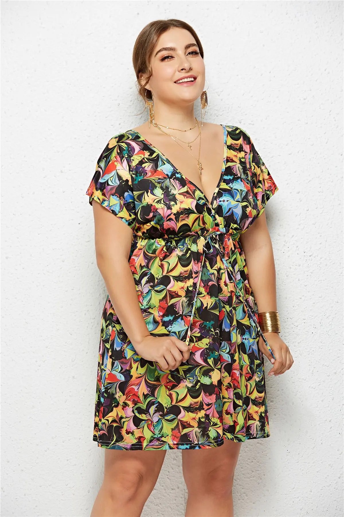 Printed deep V-neck dress with elastic waist by SHOPEZRA L.L.C. featuring a stylish, fitted silhouette and vibrant pattern.