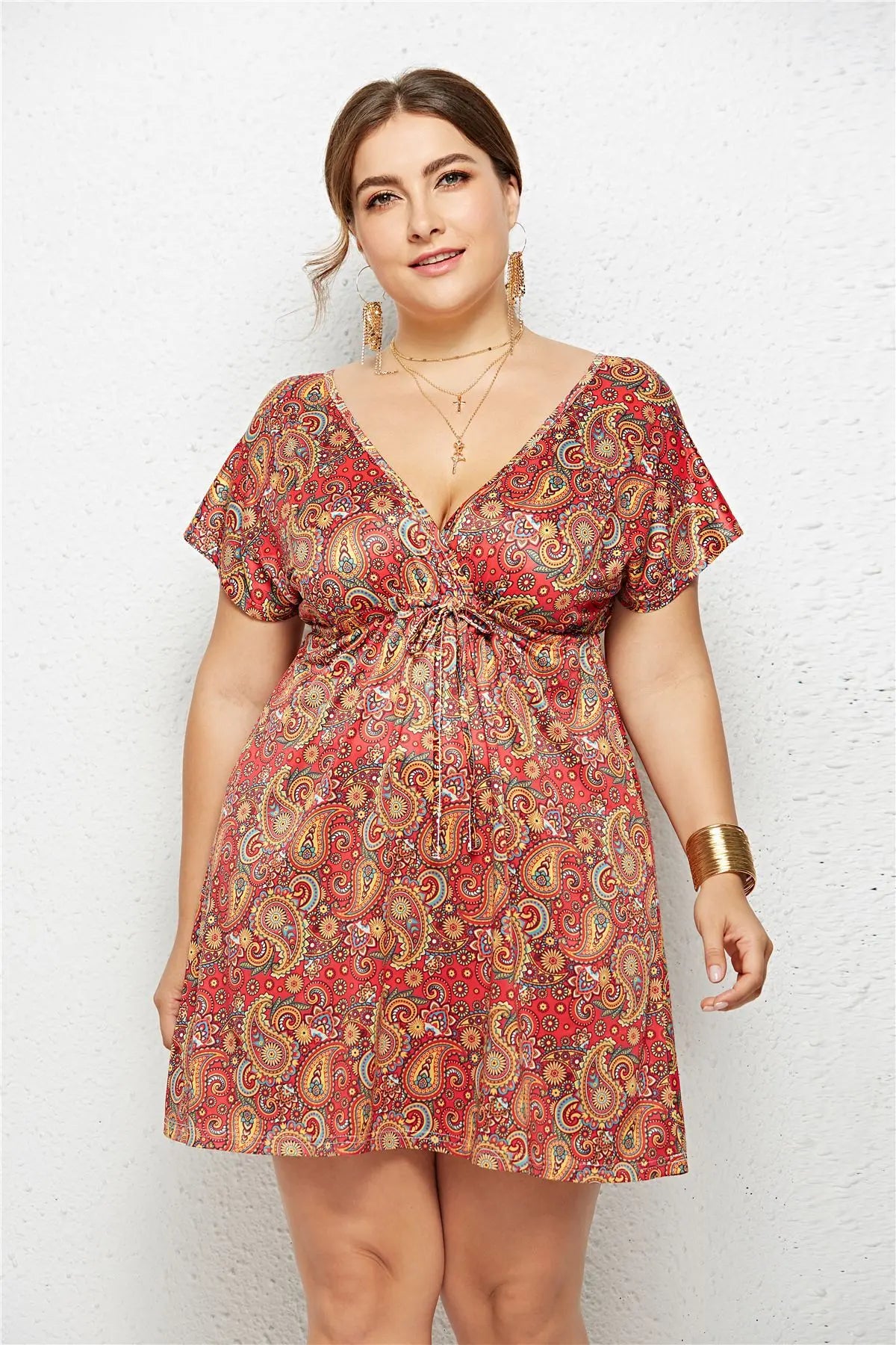 Printed deep V-neck dress with elastic waist from SHOPEZRA L.L.C., showing a stylish, fitted design and vibrant pattern.