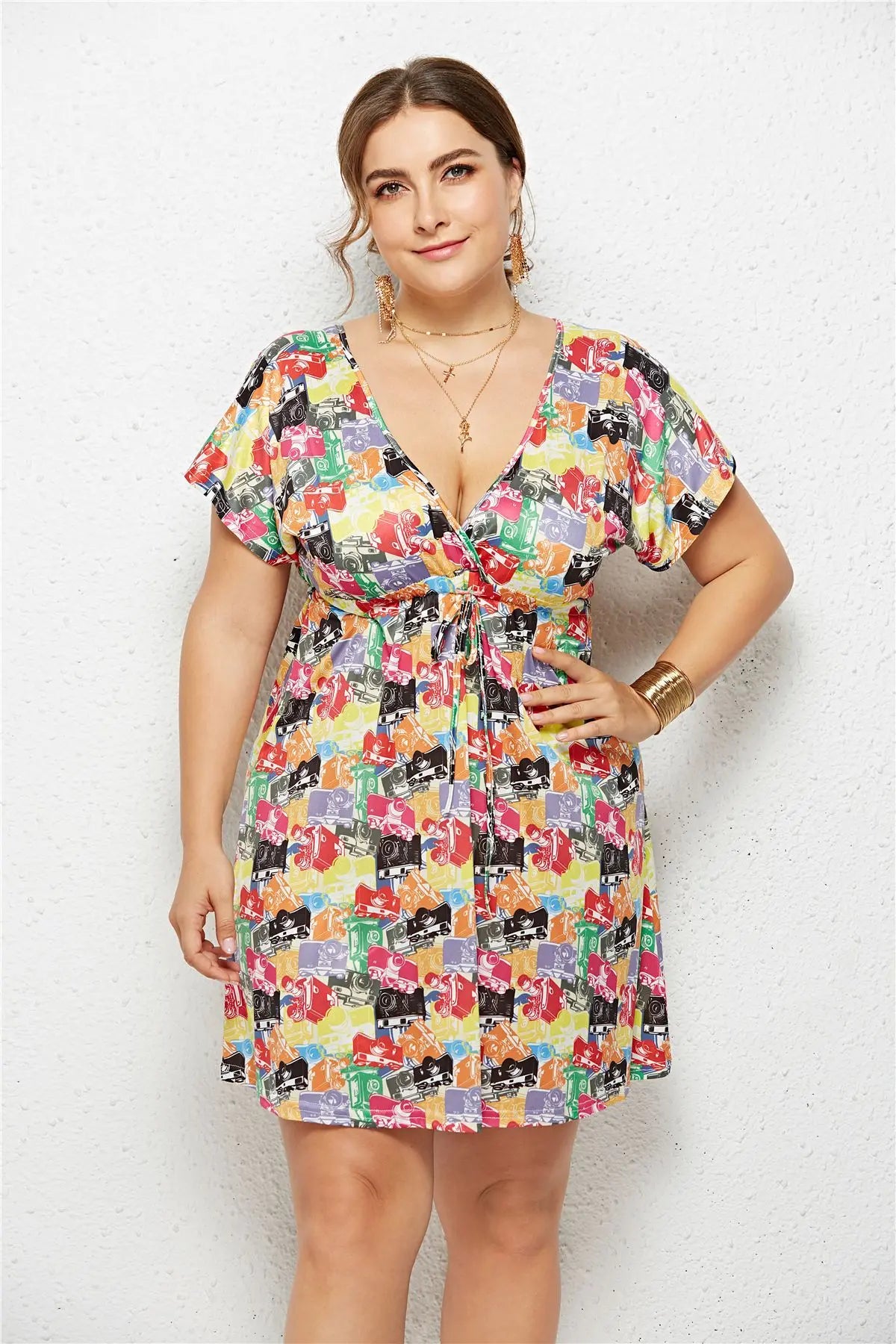 Printed deep V-neck dress with elastic waist by SHOPEZRA L.L.C., featuring a flowy fabric and stylish design.