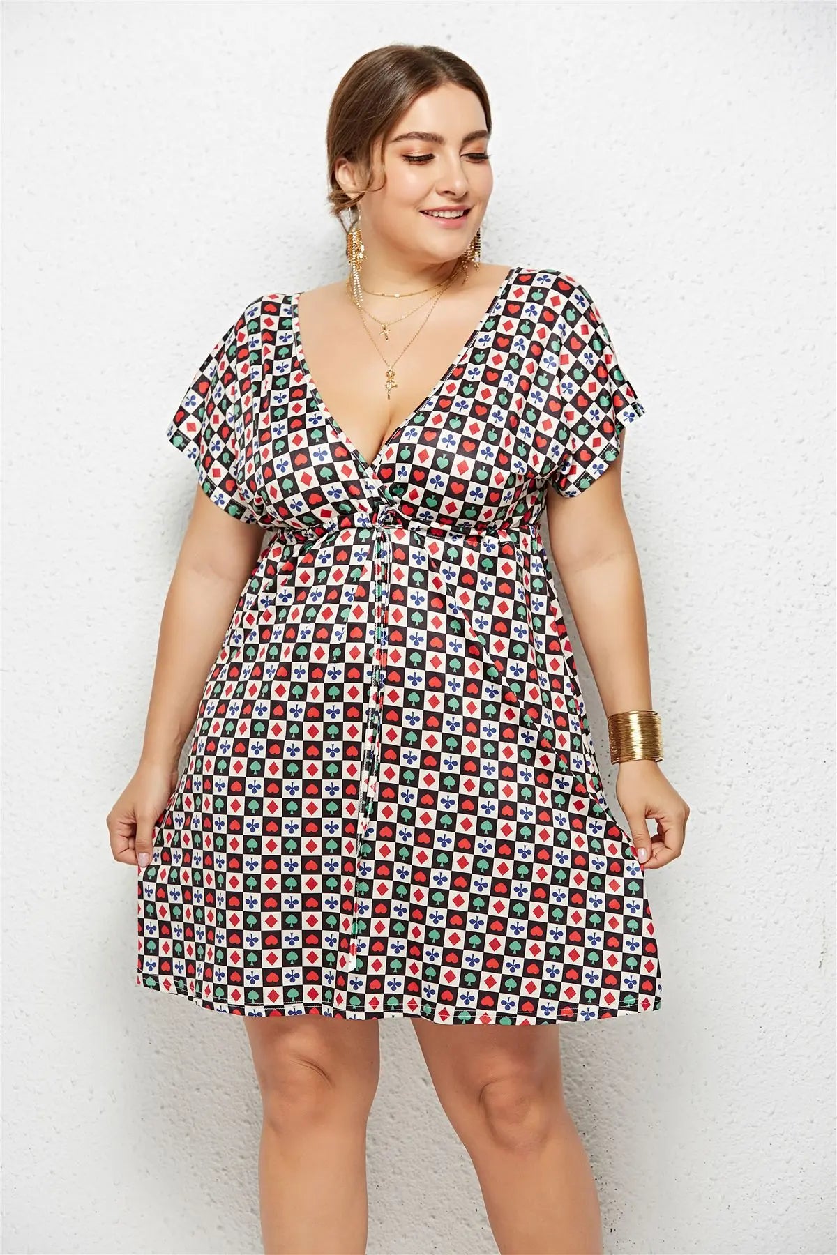 Printed deep V-neck dress with elastic waistband by SHOPEZRA L.L.C., showing a stylish, flowy design in the image.