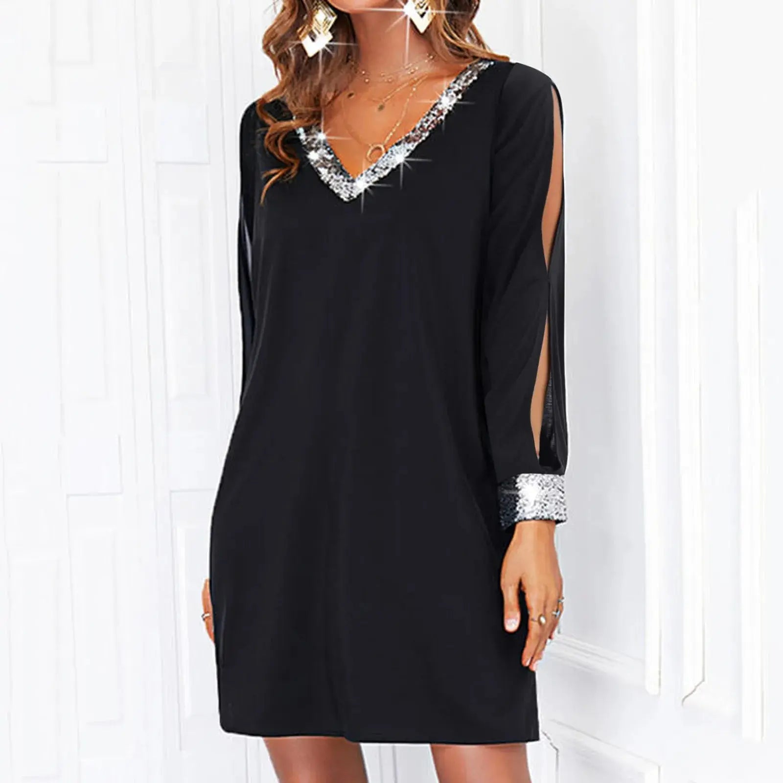 Elegant women's mini dress by Shopezra L.L.C. with shiny mesh stitching, long sleeves, V-neck, solid color, suitable for evening events.