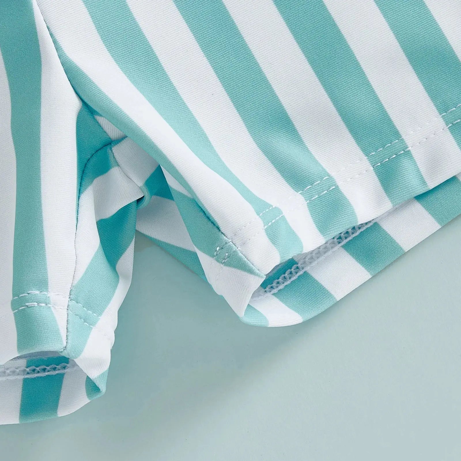 Kids' swim trunks by SHOPEZRA L.L.C. featuring colorful stripes, elastic waist, perfect for summer beach outings for baby boys.