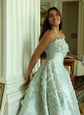 Elegant customized evening dress for women featuring a shiny, formal gown design, suitable for special occasions.