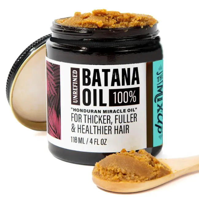 unrefined Batana Oil 100% for thicker, fuller & healthier hair in a jar with a spoonful beside it