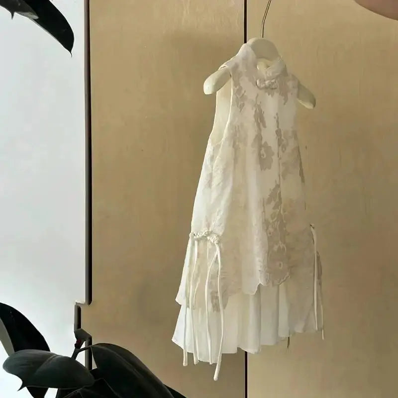 Beige baby girl cheongsam dress with traditional Chinese style, summer vest design, suitable for children’s princess or trendy summer wear.