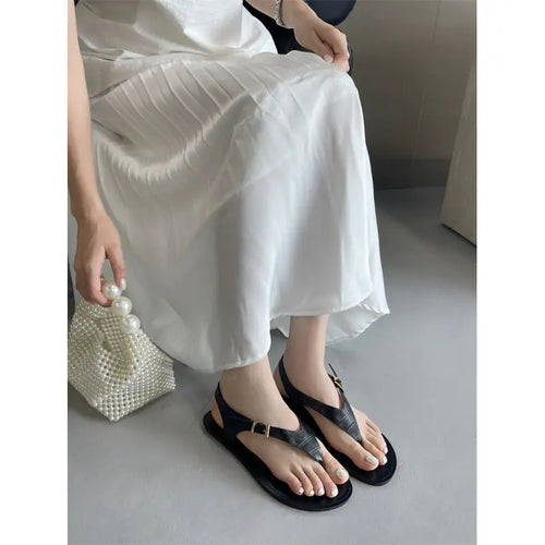Black women's summer thong flat sandals with casual Roman style, featuring a comfortable slip-on design by SHOPEZRA L.L.C.