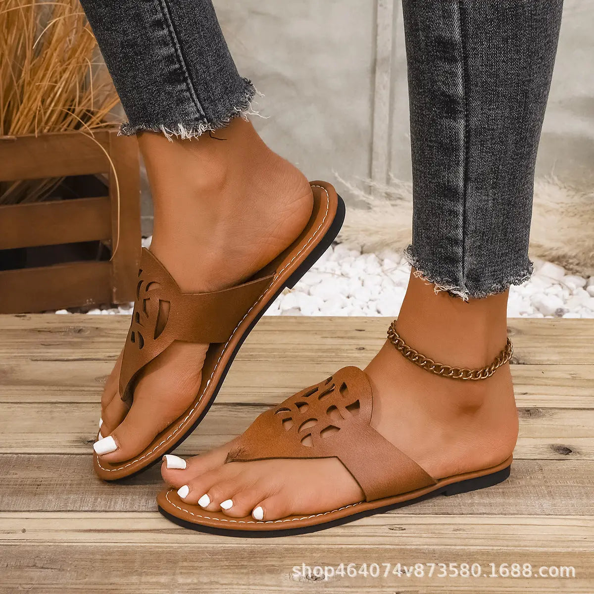 Black European and American flat thong sandals for women with hollow design, casual summer beach slippers from SHOPEZRA L.L.C.