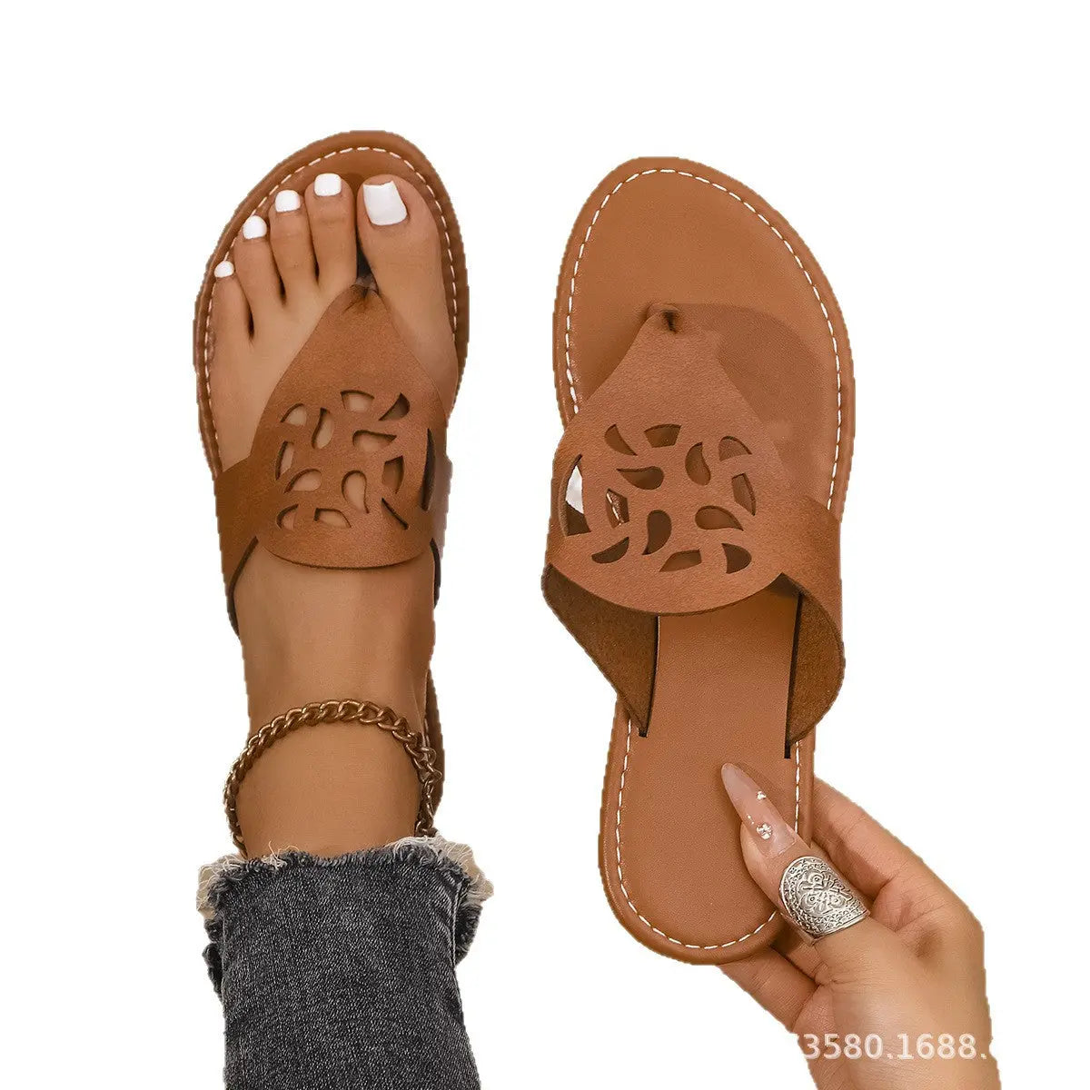 Black flat thong sandals for women with cross-border hollow design, European and American style, perfect for summer beach wear.