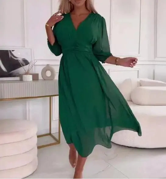 Elegant v-neck chiffon dress in green, showcasing lightweight flowy fabric and flattering V-neckline for chic style.