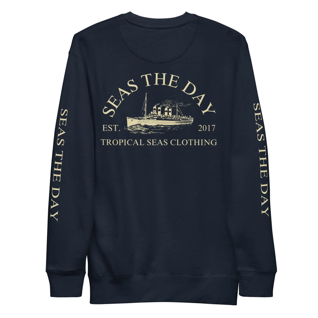 Premium casual sweatshirt featuring a vintage ship design on a navy background with 'Seas The Day' text.