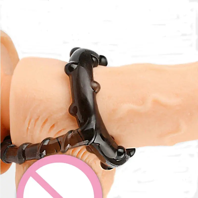 Black silicone dildo sex toy with penis rings and enlargers, designed for enhanced erection and long-lasting pleasure for men.
