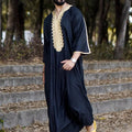 Black men's long shirt Muslim robe by SHOPEZRA L.L.C., featuring a stylish and modest design with a comfortable fit.