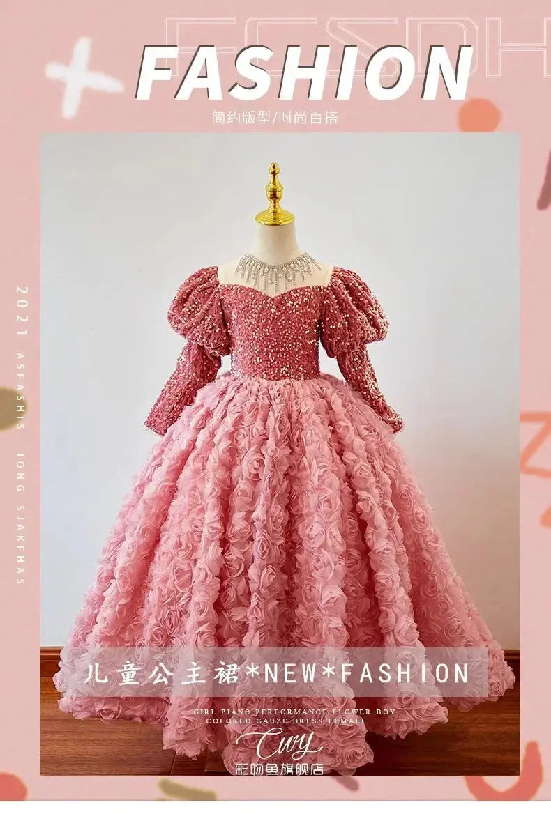 Pink shiny children's dress for girls, featuring long sleeves, suitable for birthdays, banquets, or piano performances.