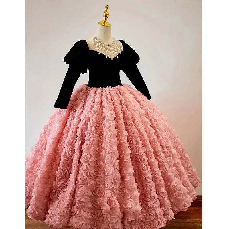 Pink children's princess dress with shiny details, long sleeves, suitable for birthday, banquet, or piano performance for girls.