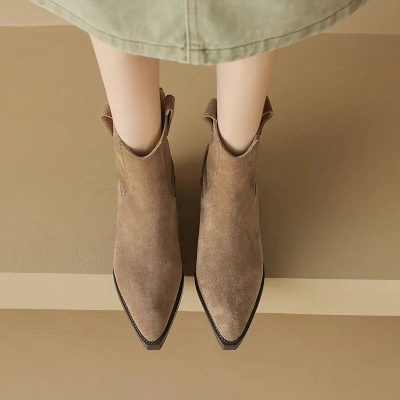 Black cow suede Western ankle boots for women with pointed toes, mid block heels, back zipper, and plush lining.