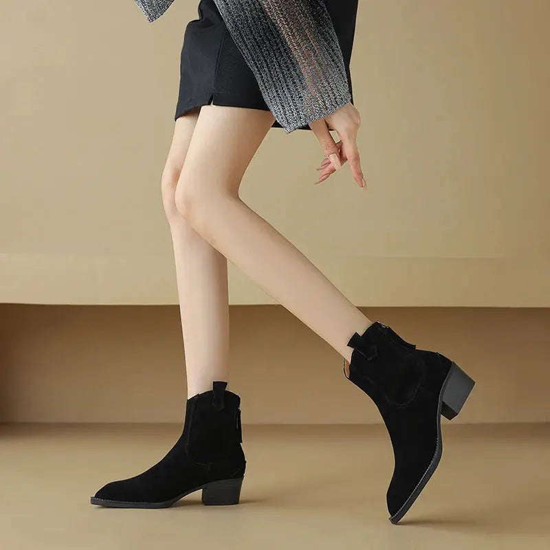 Black cow suede Western boots for women with pointed toes, mid block heels, back zipper, and plush lining for autumn winter wear.