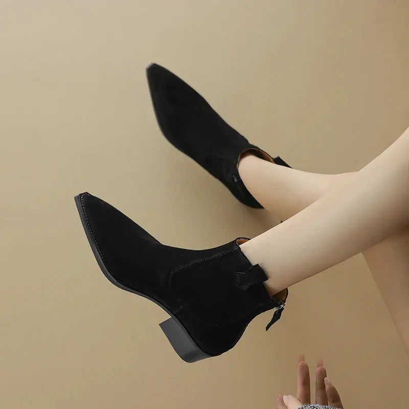 Black cow suede Western ankle boots for women with pointed toe, mid block heels, back zipper, and plush lining for autumn winter style.