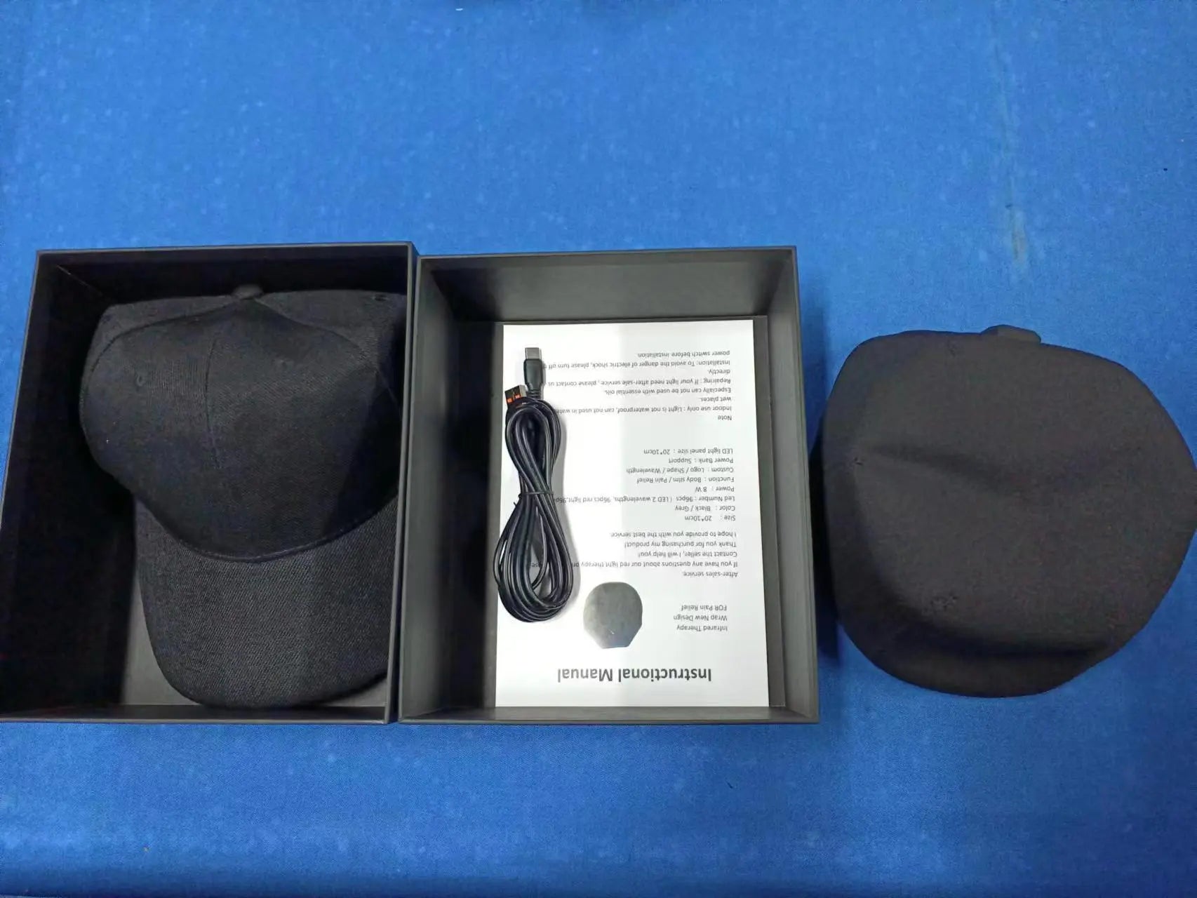 Black and red light therapy cap by SHOPEZRA L.L.C., featuring adjustable straps and LED lights for scalp treatment.
