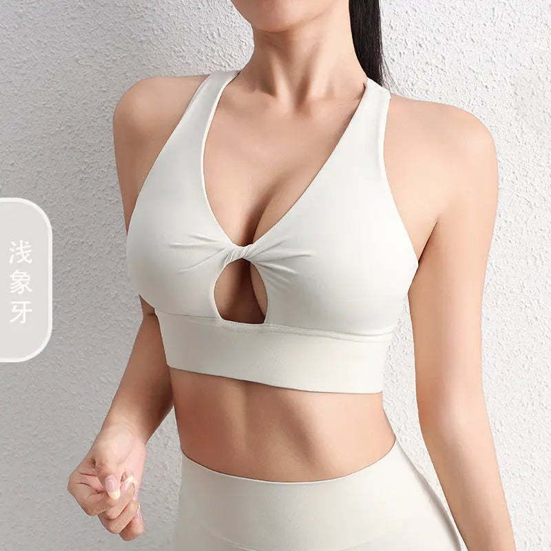 Black 2024 SHOPEZRA L.L.C. hollow yoga sports bra with beautiful back design, shockproof, gather-up fit, ideal for fitness and yoga.