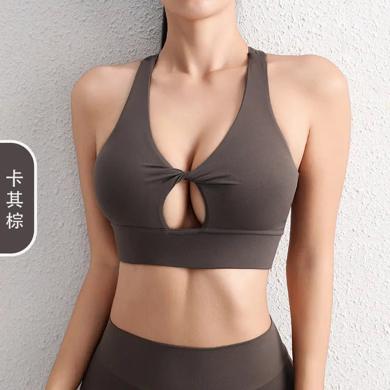 Black 2024 SHOPEZRA L.L.C. hollow yoga sports bra with beautiful back design, shockproof support, and gather-up fit for fitness.