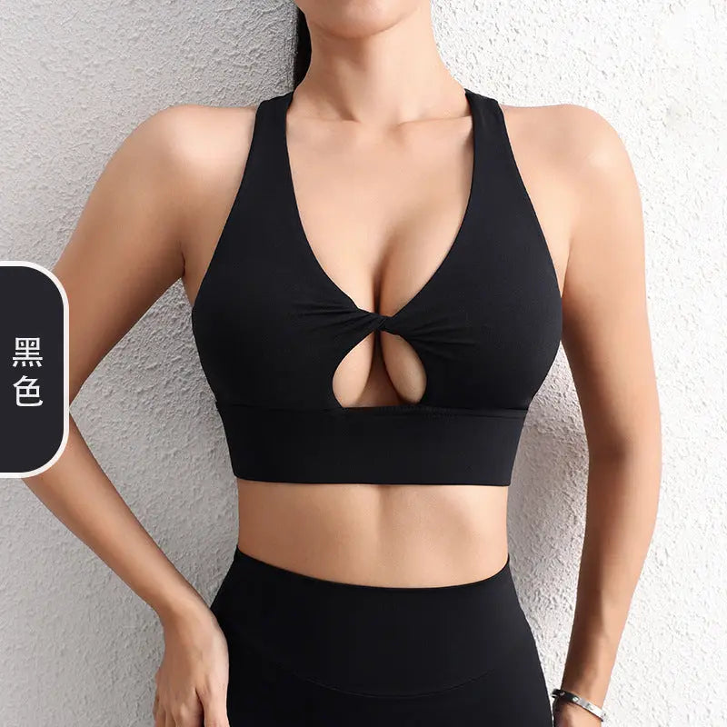 Black 2024 SHOPEZRA L.L.C. sexy hollow yoga sports bra with a beautiful back, shockproof design, and gather-up fit for fitness.