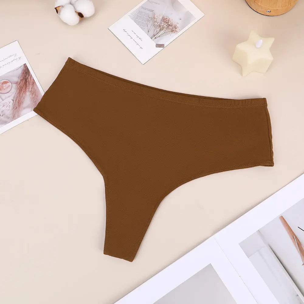 Black high-waist cotton thong by SHOPEZRA L.L.C., featuring a high split design, elastic fit, and seamless comfort for women.