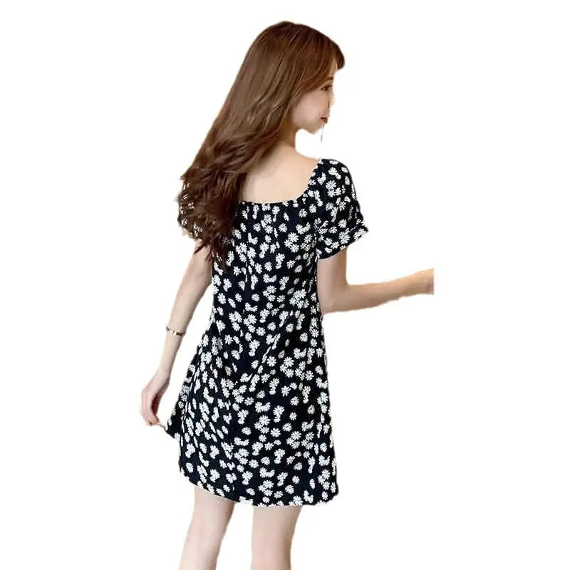 Black off-shoulder floral Daisy dress by SHOPEZRA L.L.C., slim-fit summer dress with floral pattern, trendy and flattering style.