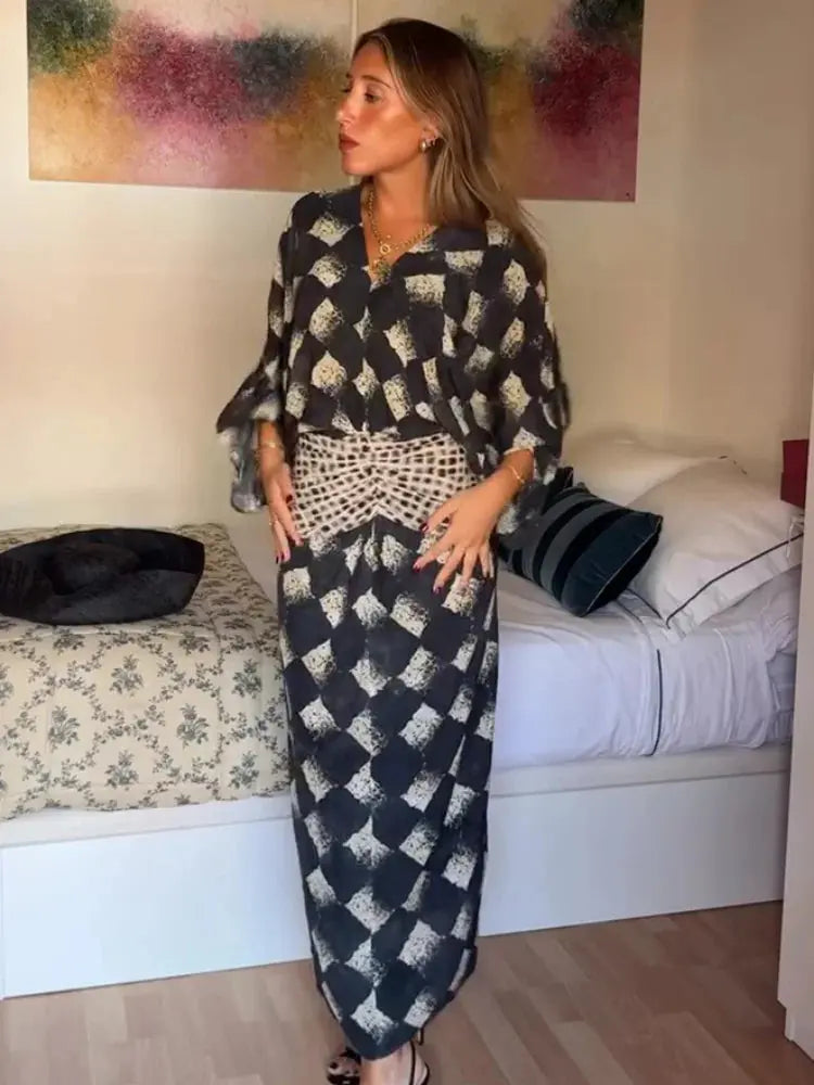 Elegant black plaid printed women's dress with V-neck, batwing sleeves, waist cinching, long length, perfect for spring and summer.
