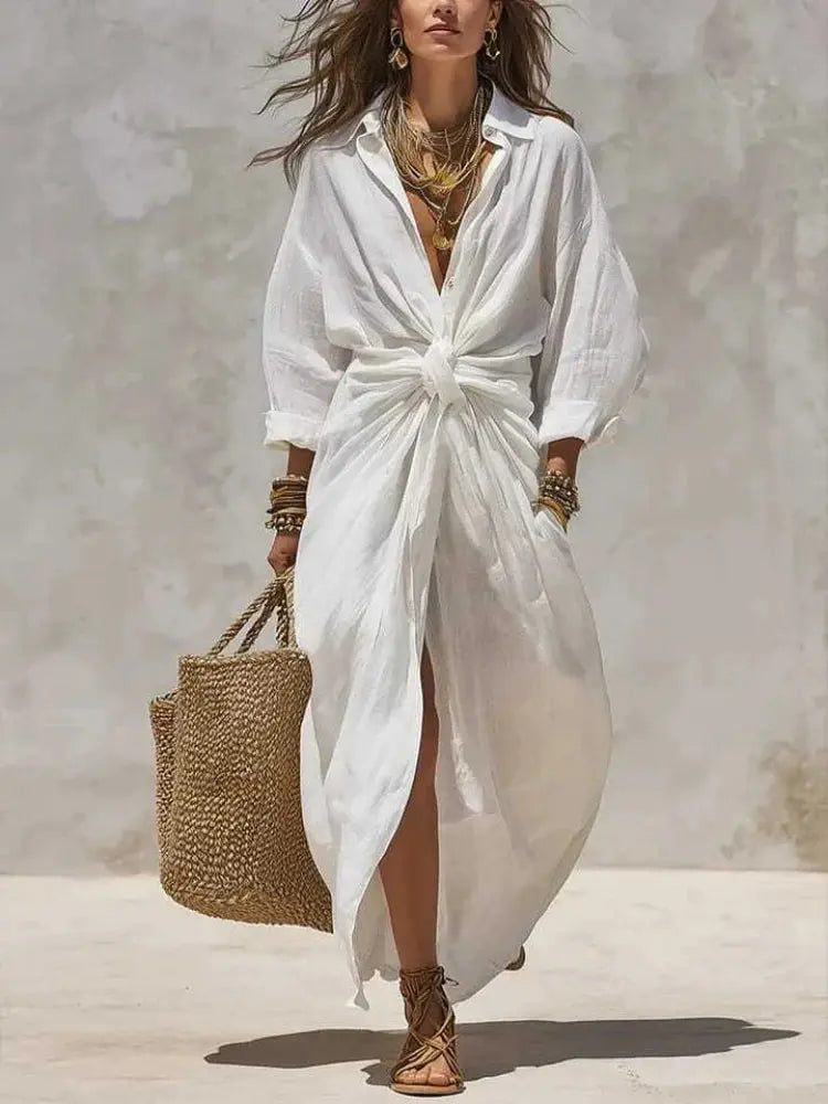 White linen cotton boho shirt dress with long sleeves, high waist, knot detail, maxi length, casual loose fit, split hem, summer beach style.
