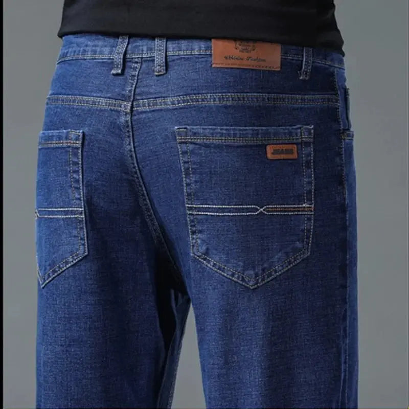 Men's straight denim jeans by SHOPEZRA L.L.C., black and blue washed cotton jeans with a classic fit and casual business style.