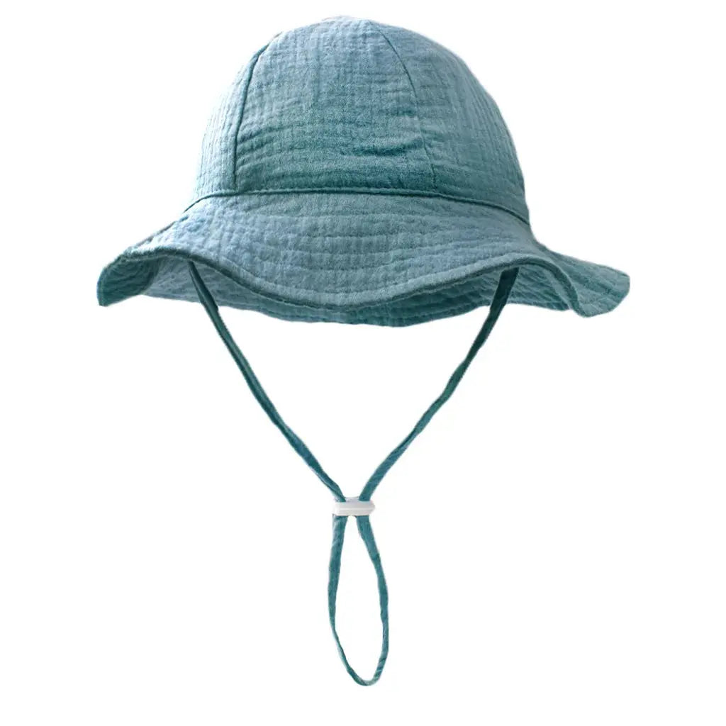 Blue baby cotton bucket hat from SHOPEZRA L.L.C. with sun protection, unisex print design for children 3-12 months, perfect for outdoor activities.