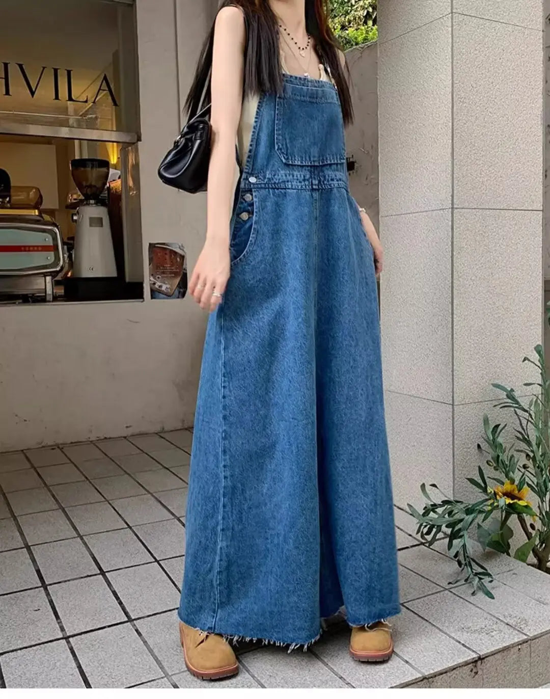 Blue denim suspender dress for women featuring a loose fit, designed for a slimming, age-reducing look, perfect for tall women.