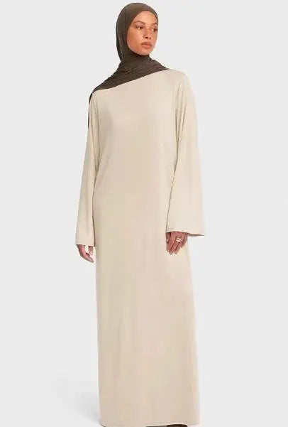 Brown women's Eid modest dress with long kaftan style, prayer abaya, and Ramadan robe, featuring traditional Arabic and Moroccan design.