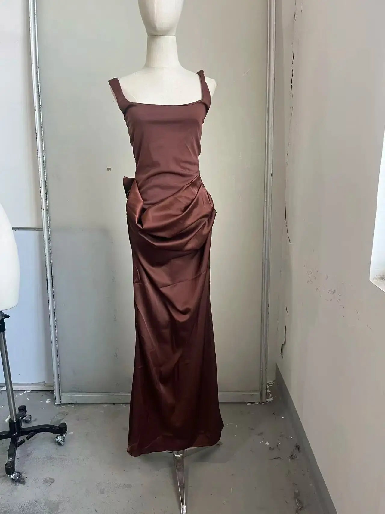 Elegant brown strapless pleated maxi dress for women by SHOPEZRA L.L.C., sleeveless, waist-cinching, split design for evening parties.