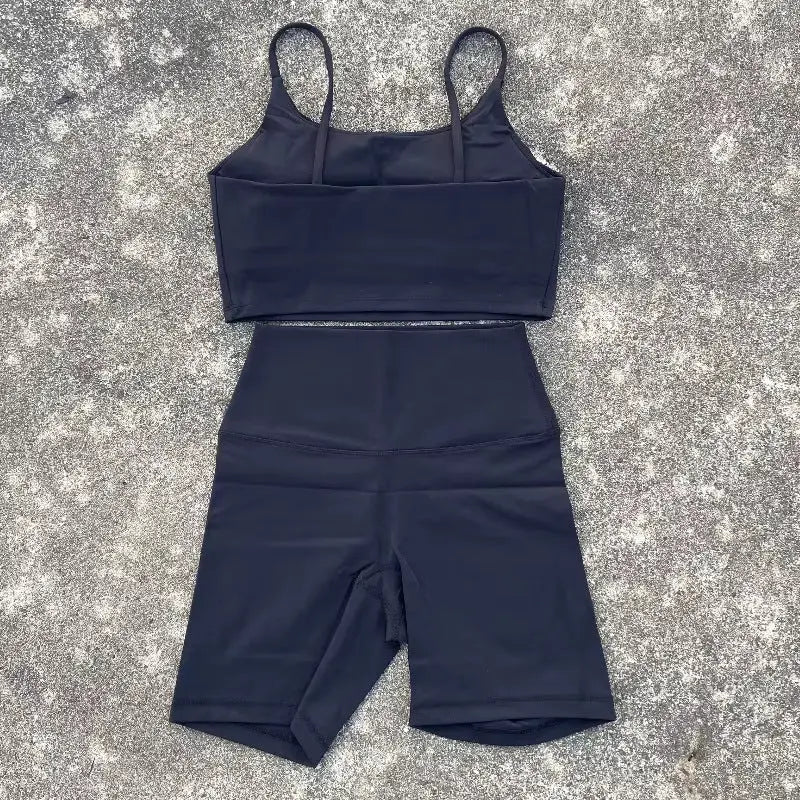 Purple women's yoga cycling shorts set with U-shaped strap bra and outer wear, ideal for gym, yoga, and sports activities.