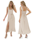 Champagne tea length graduation dress featuring a smocked back, square neck, and flowy ruffle slit skirt, perfect for women.