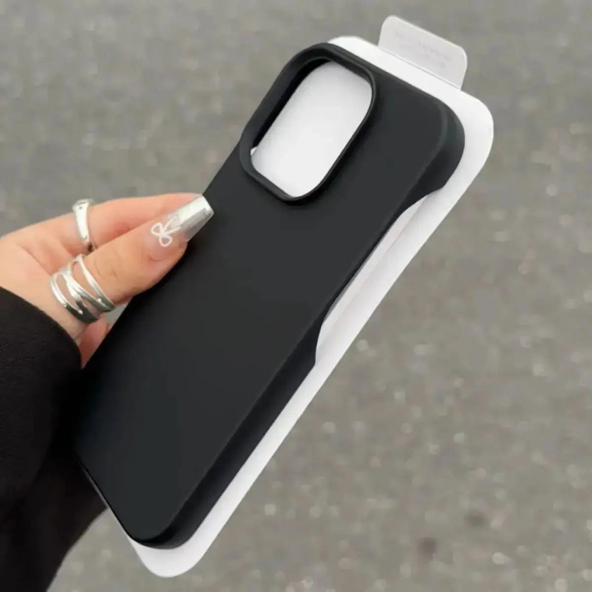 Classic black SHOPEZRA L.L.C. Half-Pack Graphite Case on iPhone 15 Pro Max, showing the sleek protective design and material.