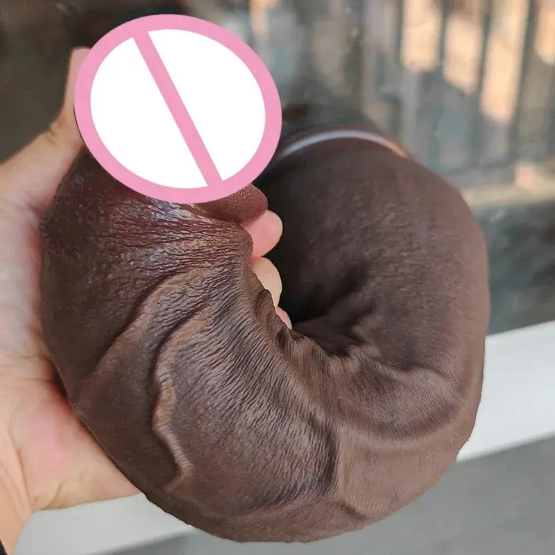 Realistic big silicone coffee-shaped dildo for women, with detailed vaginial and anal design, soft texture, and suction base for masturbation.