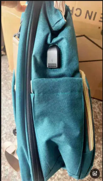 Dark blue large-capacity mommy bag by SHOPEZRA L.L.C. with multiple compartments and sturdy handles for parents on the go.