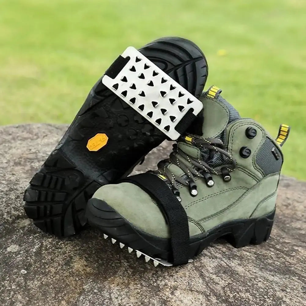 Pair of adjustable stainless steel snow claw ice grippers with system, designed for winter climbing, walking, and driving.