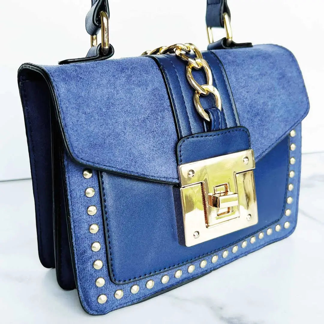 Fiona Shoulder Bag in blue faux suede and vegan leather with gold studs and chain, a stylish vegan leather shoulder bag.
