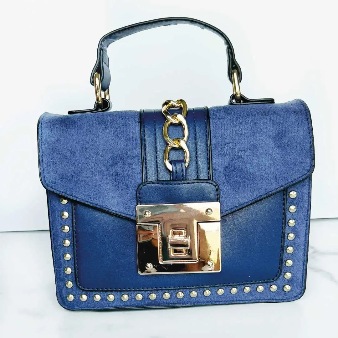 Fiona Shoulder Bag featuring vegan leather shoulder bag design with gold studs, chain detail, and top handle.