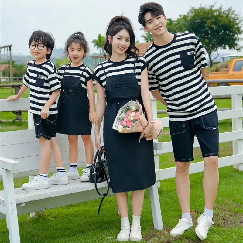 Matching family outfits featuring a woman, mom, daughter, dad, and son in coordinated casual dresses and shirts from SHOPEZRA L.L.C.