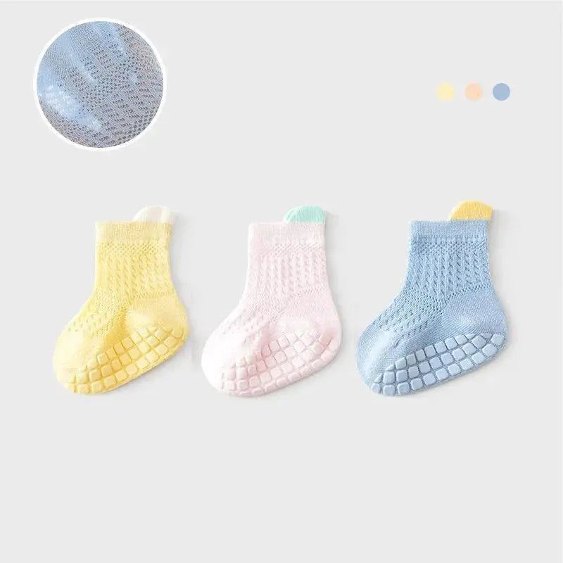 Set of 3 pairs of breathable, thin cotton baby girl socks in various colors, featuring non-slip soles for infants and kids.