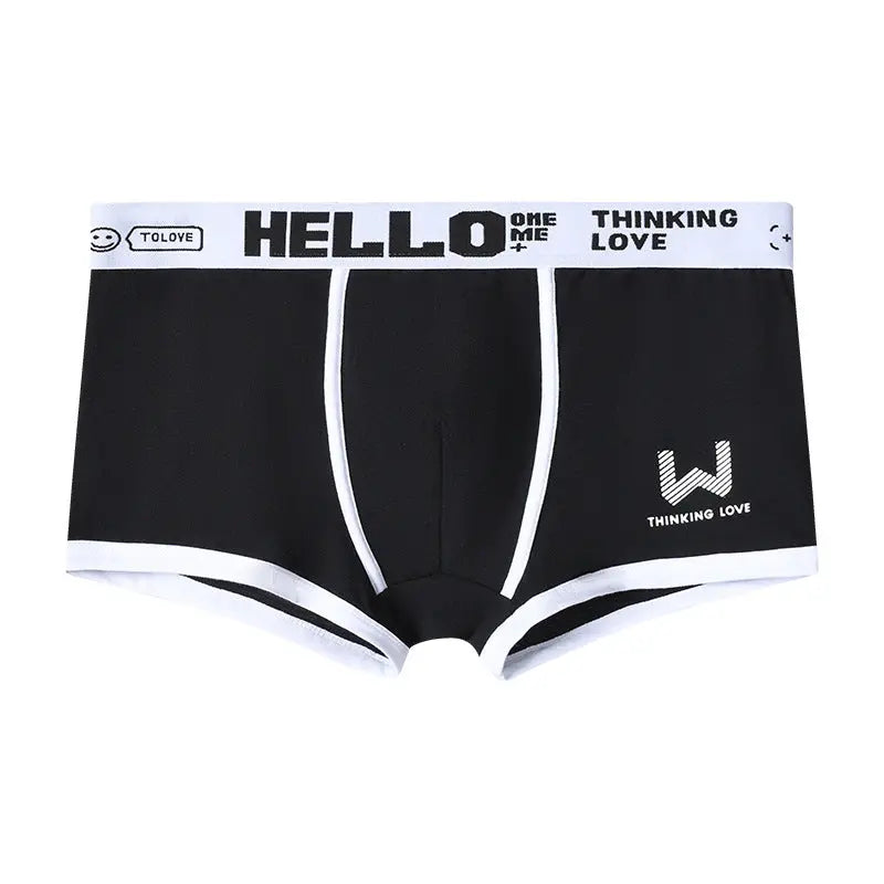 Dingxin men's breathable cotton middle waist boxers with trendy letter print, in ginger yellow, comfortable and traceless design.
