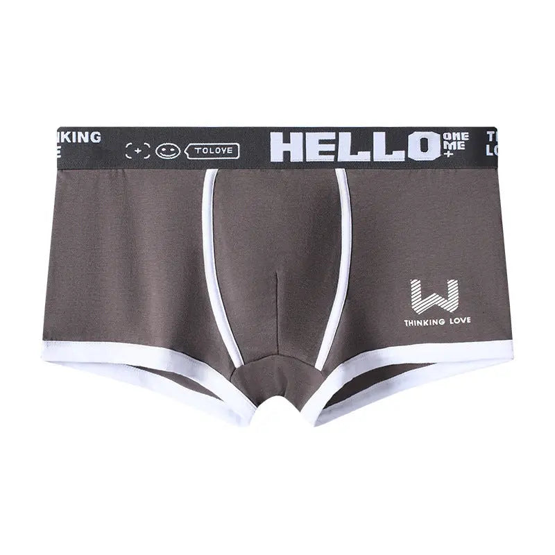 Dingxin men's breathable mid-waist boxer briefs in ginger yellow with traceless letter design, comfortable and trendy youth underwear.