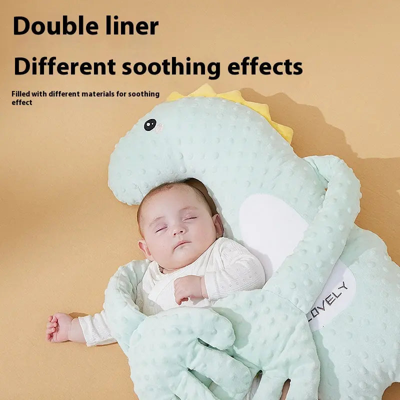 Cute baby sleeping with adorable baby pillow for infants in a charming dinosaur shape.