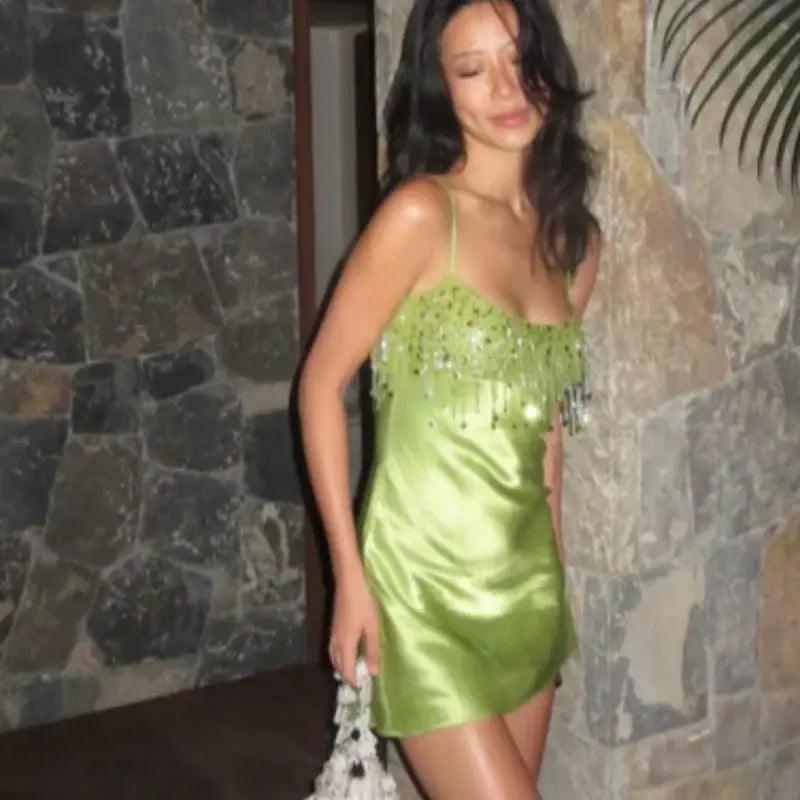 Green satin sequin tassel dress by SHOPEZRA L.L.C., elegant low-neck mini with straps, stylish back zipper, perfect for beach parties.