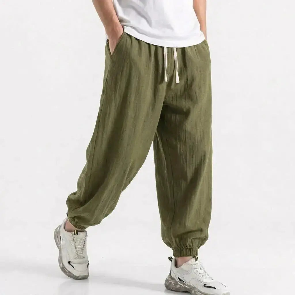 Green men's cotton linen harem trousers with drawstring, loose fit, casual streetwear style for gym, daily wear, and summer.