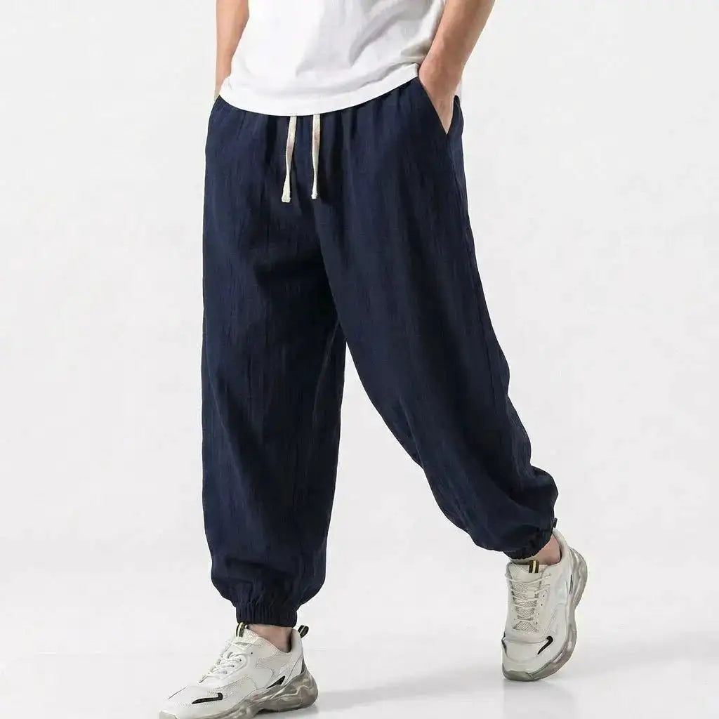 Men's green cotton linen harem trousers with drawstring, loose fit, casual streetwear style for gym, daily wear, spring and summer.
